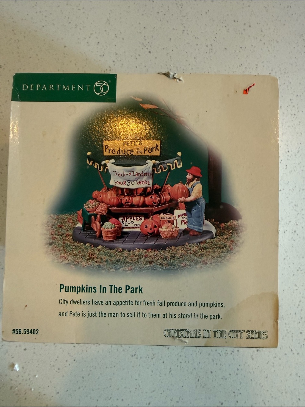 Department 56 Pumpkins In The Park Figurine with Orange Pumpkins and Green Sign
